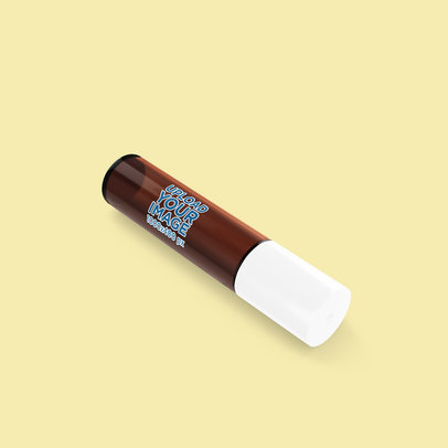 Essential Oil Mockup Featuring an Amber Bottle Lying on a Colored Surface 4201-el1