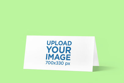 Mockup Featuring a Horizontal Bifold Brochure Placed on a Plain Color Surface 