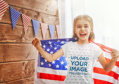 T-Shirt Mockup of a Happy Girl Holding a USA Flag 