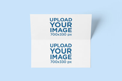 Mockup Featuring an Open Bifold Brochure Placed on a Plain Color Surface 4176-el1