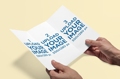 Mockup of a Man Holding a Trifold Brochure 4182-el1