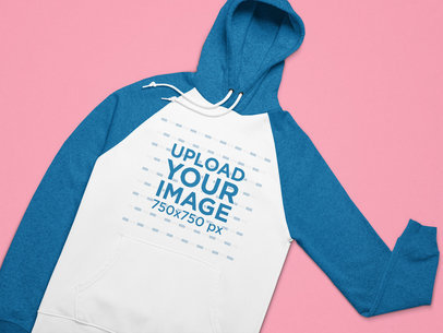 Mockup of a Raglan Style Pullover Hoodie on a Flat Surface 25646
