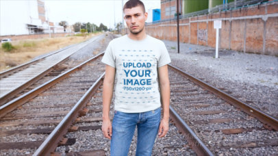 T-Shirt Video of a Man Posing by the Train Rails