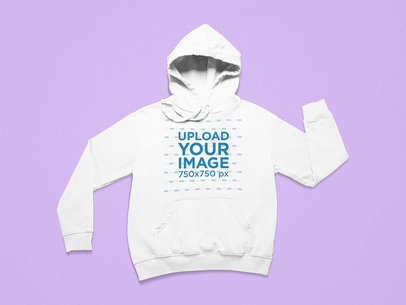 Mockup of a Pullover Hoodie with Folded Sleeves on a Colorful Surface