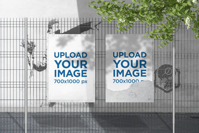 Mockup of Two Posters Placed on a Wire Fence