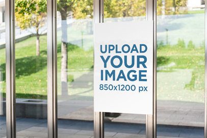 Mockup of a Poster Placed on a Glass Wall 