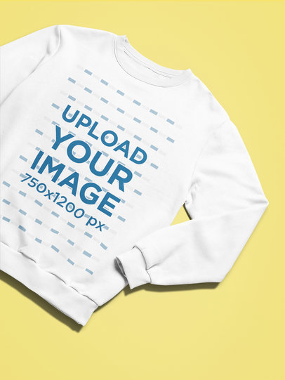 Mockup of a Sweatshirt with a Folded Sleeve on a Solid Color Backdrop