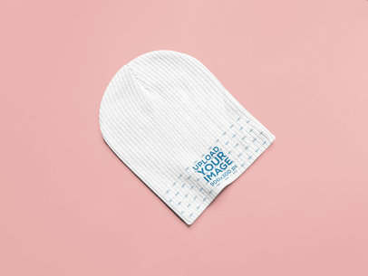 Mockup of a Beanie Laid Flat on a Surface 25342