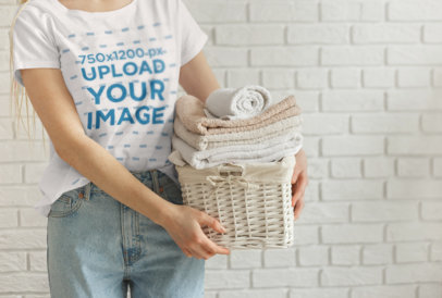 T-Shirt Mockup of a Woman Holding a Basket of Clean Towels 34417-r-el2