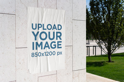 Mockup of a Poster Glued Onto a Wall