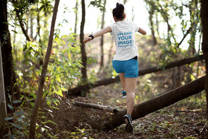 Back-View Tee Mockup of a Woman Running in the Woods