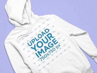 Front-View Mockup of a Hoodie Flat Laid on a Solid Surface