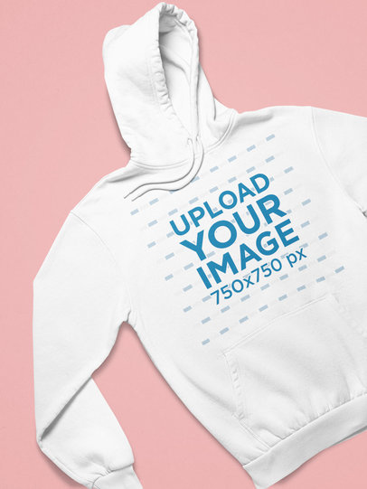 Mockup of a Pullover Hoodie Facing Front Against a Customizable Surface 25644