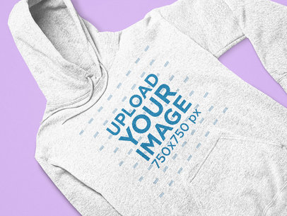 Closeup Mockup of a Heathered Hoodie Laid on a Solid Surface 25561
