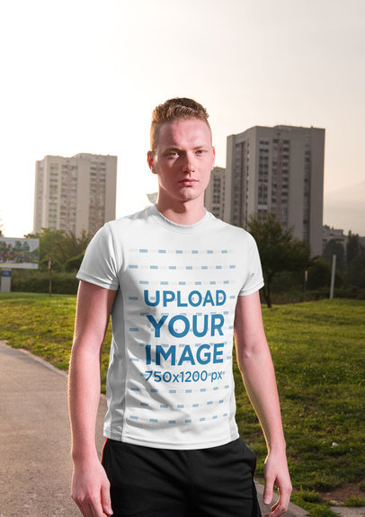 Mockup of a Serious-Looking Man Wearing a Round Neck Tee Against City Buildings 34409-r-el2