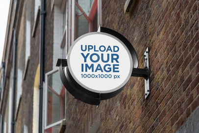 Mockup of a Round Outdoor Sign on an Old Brick Building