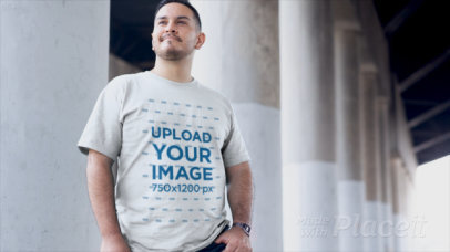 Apparel Video of a Man with a Plus Size T-Shirt Standing at a Parking Lot 12464