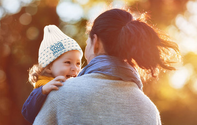 Beanie Mockup Featuring a Little Girl Being Carried by Her Mom at Sunset 34665-r-el2