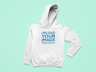 Flat Laid Mockup Featuring a Heathered Hoodie with a Folded Sleeve