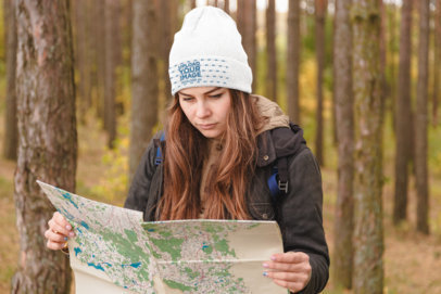 Beanie Mockup of a Woman in the Woods Looking at a Map 34528-r-el2