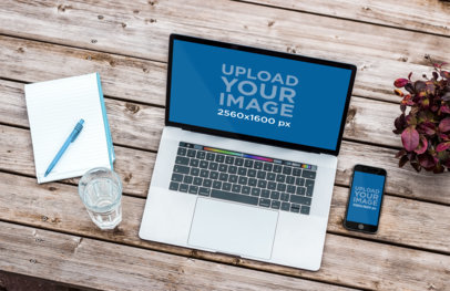 Mockup of a 15-inch MacBook Pro and an iPhone over a Wooden Table 2466-el1