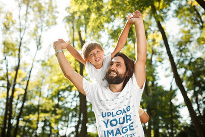 Tee Mockup of a Bearded Man Lifting His Son over His Shoulders
