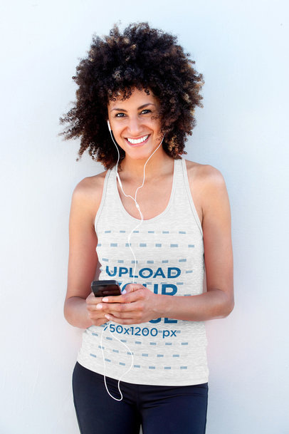 Mockup of a Joyful Woman with a Cellphone Wearing a Heathered Tank Top 