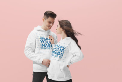 Mockup of a Cool Young Couple Wearing Pullover Hoodies at a Studio 34592-r-el2