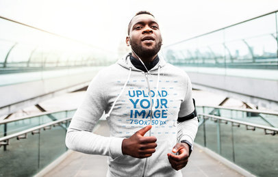 Hoodie Mockup of a Runner Crossing a Modern Bridge