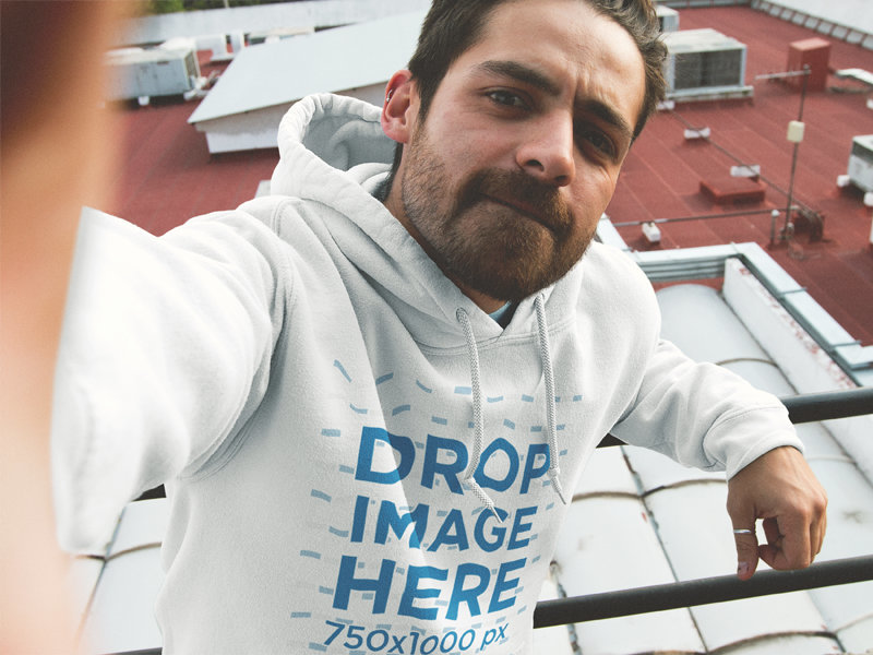 Cool Guy Wearing a Pullover Hoodie Mockup and Taking a Selfie