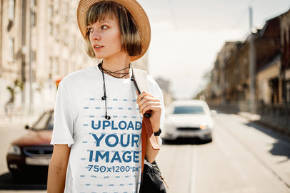 T-Shirt Mockup of a Stylish Woman Standing in the Street