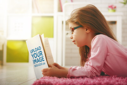 Book Mockup of a Little Girl Reading in Her Room