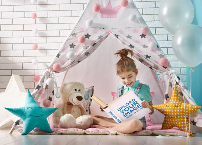 Book Mockup of a Girl Reading Under a Tipi