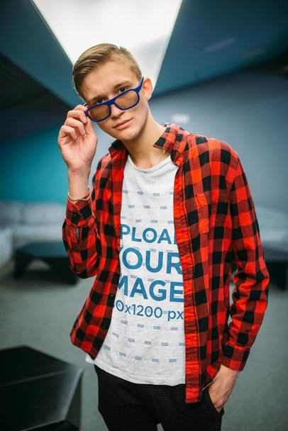 Mockup of a Man with a Geek Look Wearing a Heathered T-Shirt