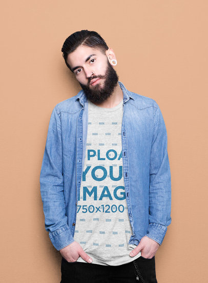 Heathered T-Shirt Mockup of a Bearded Man with an Ear Expansion