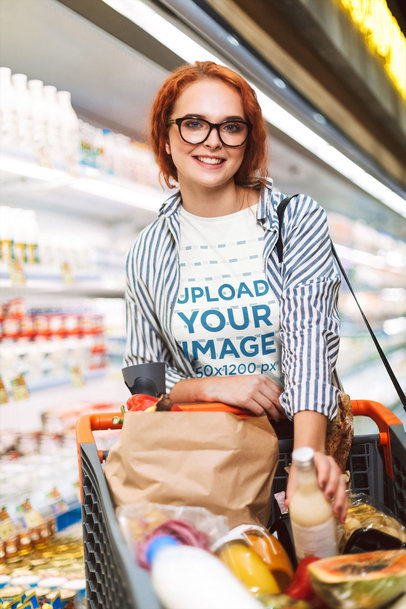 T-Shirt Mockup of a Happy Young Woman Grocery Shopping 