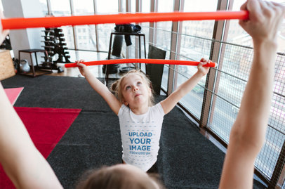 Tee Mockup of a Little Girl Training with Her Mom