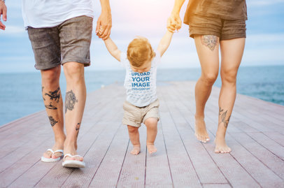 T-Shirt Mockup of a Baby Walking on the Beach with His Parents 34296-r-el2