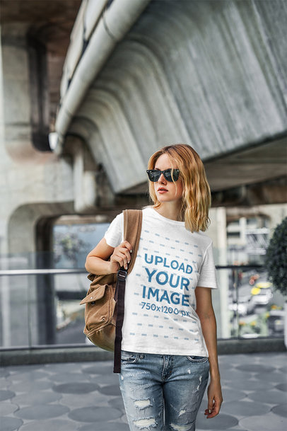 Mockup of a Woman Wearing a Round-Neck T-Shirt in an Urban Setting 