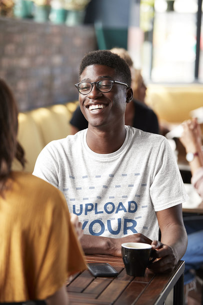 Mockup of a Young Man with a Heathered T-Shirt Chatting with a Friend