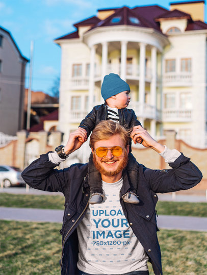 T-Shirt Mockup Featuring a Smiling Dad Carrying His Baby on His Shoulders