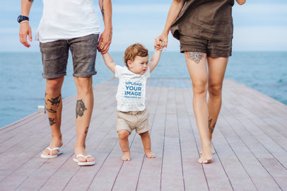 T-Shirt Mockup of a Baby Boy Taking His First Steps with Mom and Dad 34302-r-el2