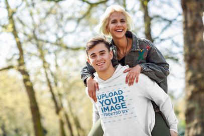 Mockup of a Man with a Hoodie Carrying His Girlfriend