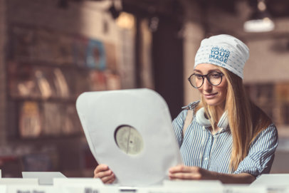 Beanie Mockup of a Woman Checking out a Vinyl Record at a Music Store 34366-r-el2