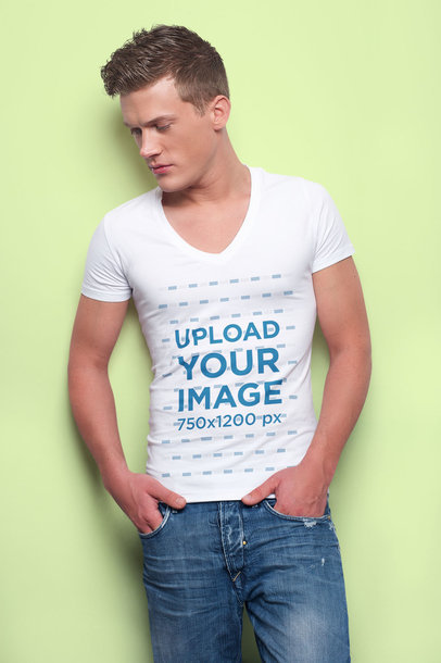 V-Neck Tee Mockup Featuring a Man with a Modern Haircut at a Studio