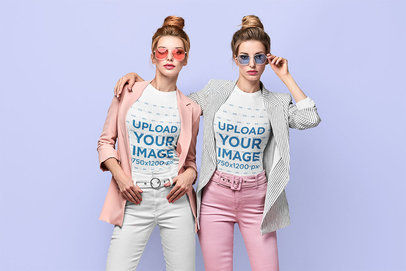 T-Shirt Mockup Featuring Twin Sisters Posing at a Studio
