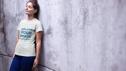 T-Shirt Video of a Relaxed Woman Leaning on a Concrete Wall 12891