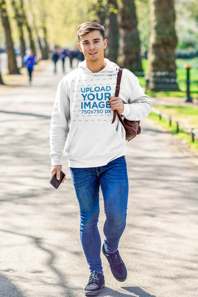Pullover Hoodie Mockup of a Man Walking at a Park