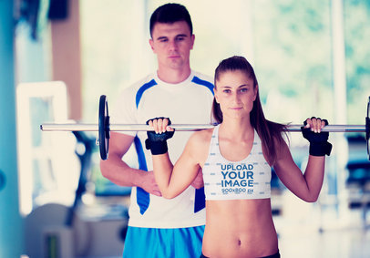 Sports Bra Mockup of a Fit Woman Lifting Weights 