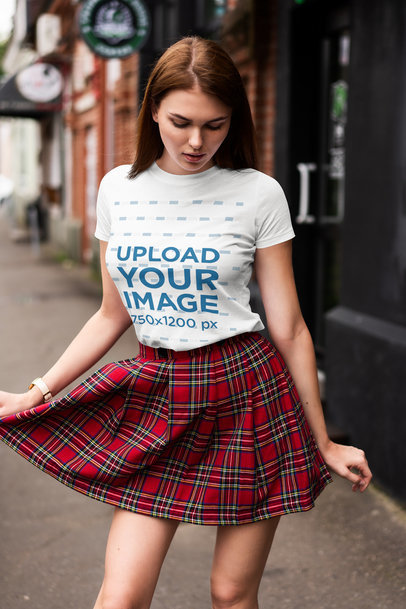T-Shirt Mockup of a Woman Wearing a Tartan Skirt